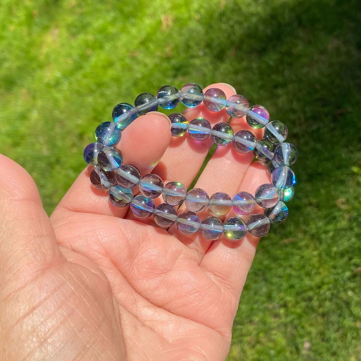 Black Aura Quartz Bracelet-Gemstone Jewelry This bracelet is made with black aura quartz and stretchy elastic. Although the name of the stone is black aura quartz, be reassured that the beads are beautiful blue in color. Packaging: This bracelet will come