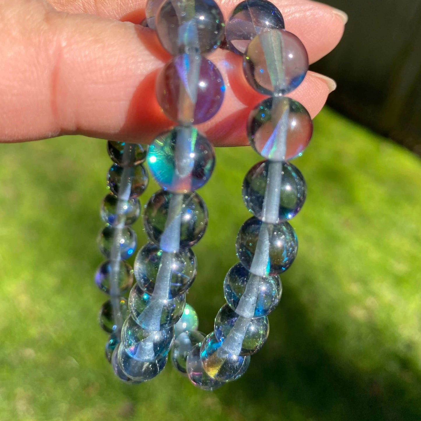 Black Aura Quartz Bracelet-Gemstone Jewelry This bracelet is made with black aura quartz and stretchy elastic. Although the name of the stone is black aura quartz, be reassured that the beads are beautiful blue in color. Packaging: This bracelet will come
