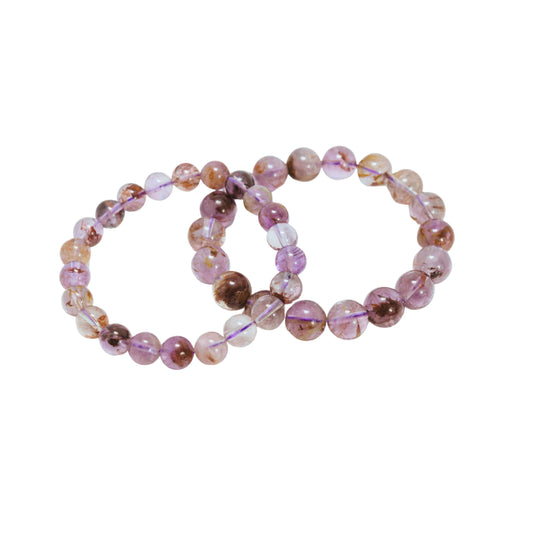 Auralite 23 Bracelet-Gemstone Jewelry This bracelet is made with genuine auralite 23 gemstones, also referred to as Canadian Chevron Amethyst, and stretchy elastic. Packaging: This bracelet will come to you in an organza gift bag, along with an informatio