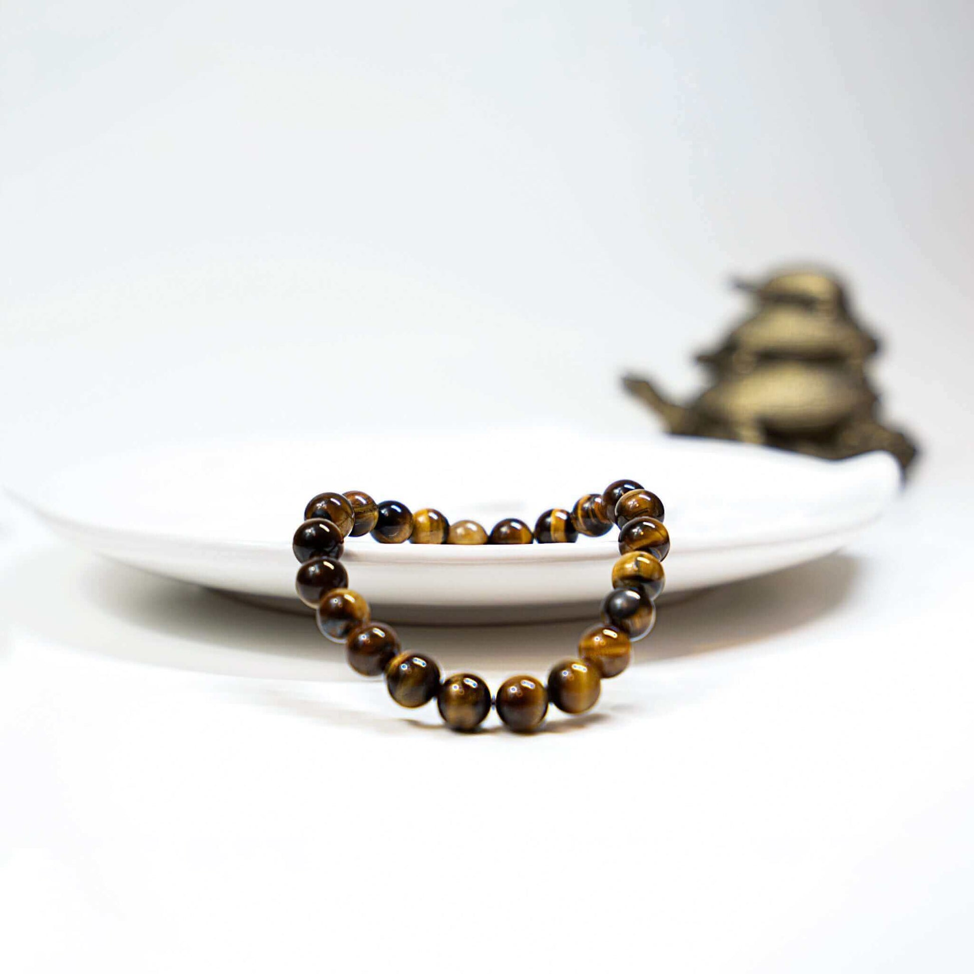 Gold Tiger Eye Bracelet-Gemstone Jewelry This bracelet is made with gold tiger eye and stretchy elastic. ♥ Packaging: This bracelet will come to you in an organza gift bag, along with an information sheet on the various crystal meanings. Properties: Gold